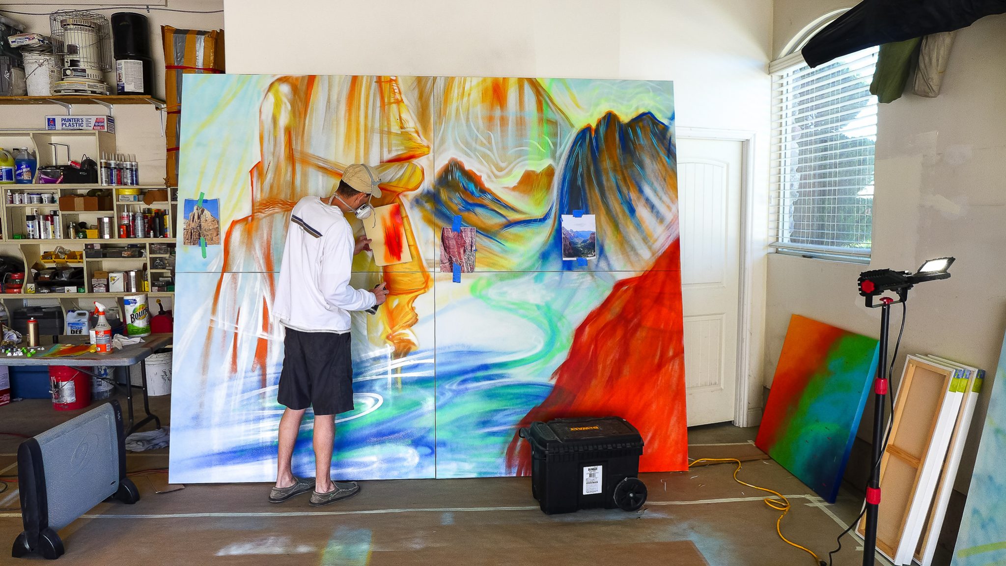 artist mike bowen painting in garage